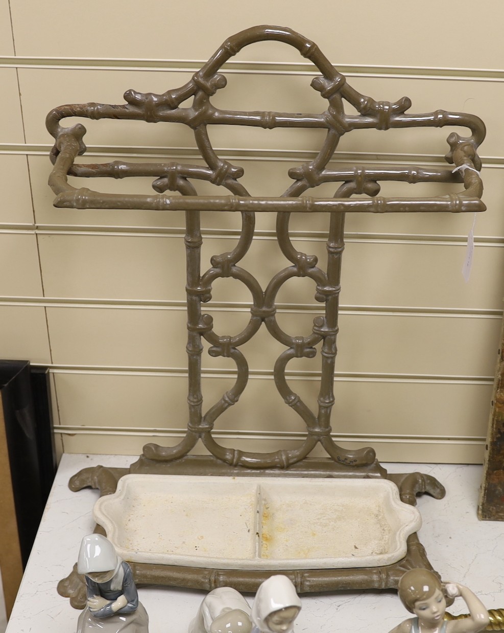 A French Godin Dequenne enamel iron faux bamboo stick stand, 60cms high